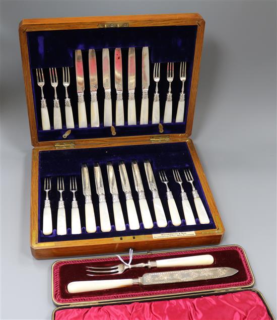 A cased set of twelve pairs of late Victorian silver dessert eaters and a cased knife and fork.